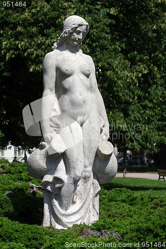 Image of White statue of woman in the city park