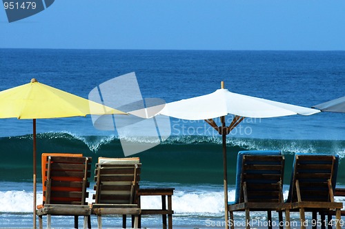 Image of colorful beach umbrellas with seats