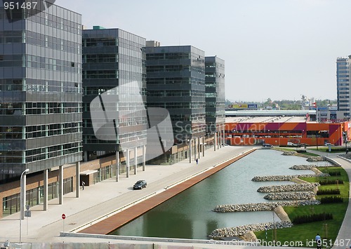 Image of Modern architecture with lake and garden