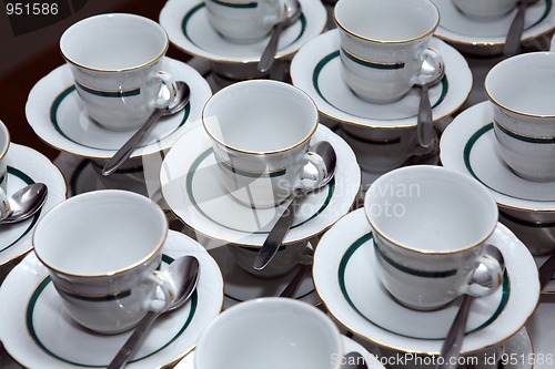 Image of White porcelain tea cups with gold decoration