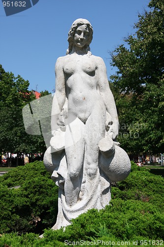 Image of White statue of woman in the city park