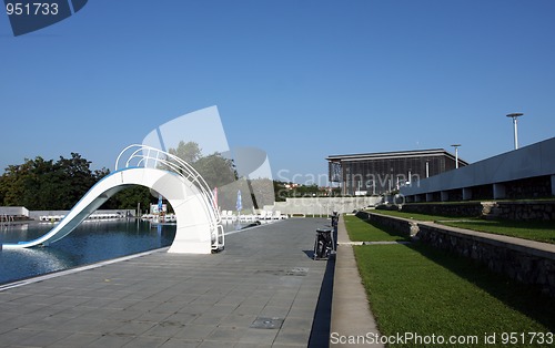 Image of dispeopled bath pool with white slide