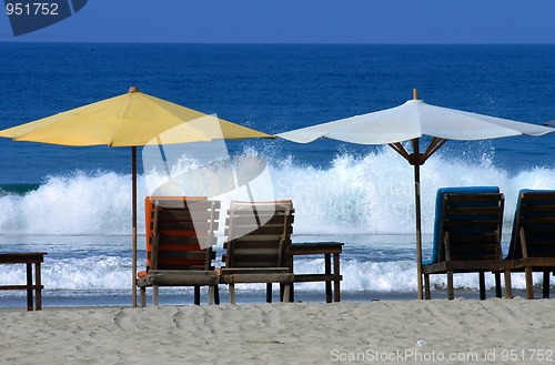 Image of colorful beach umbrellas with seats