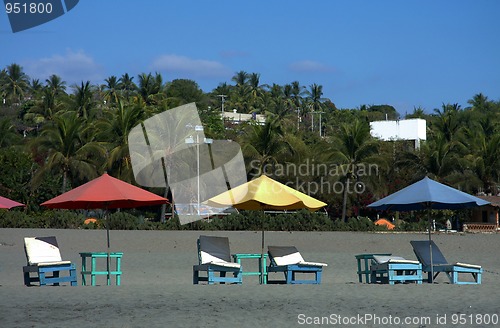 Image of colorful beach umbrellas with seats