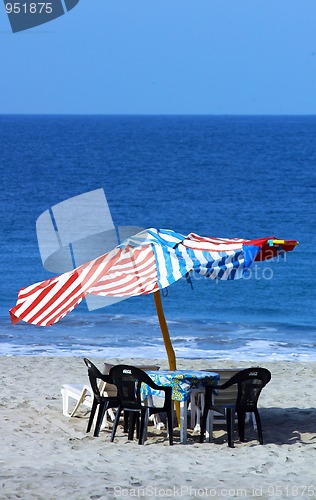 Image of colorful beach umbrellas with seats