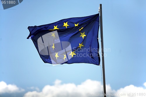 Image of Blue flag of European Union on the cloudy sky