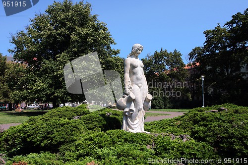 Image of White statue of woman in the city park