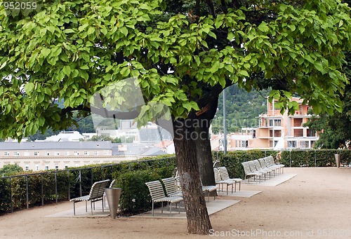 Image of Park on the riverside with white benches