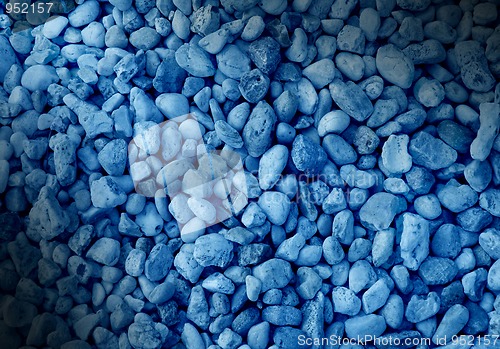 Image of Smooth blue pebble background dramatically lit.