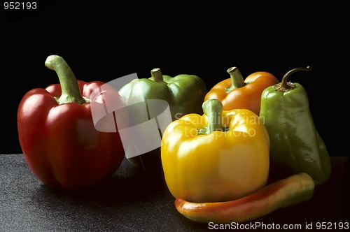 Image of Bell and Chili peppers against black