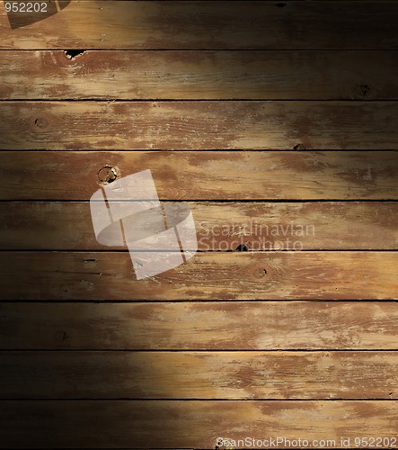 Image of Distressed wooden surface lit diagonally