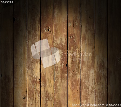 Image of Distressed wooden surface lit dramatically