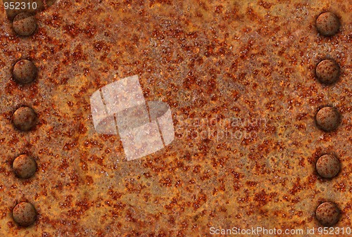 Image of Rusted metal surface with rivets