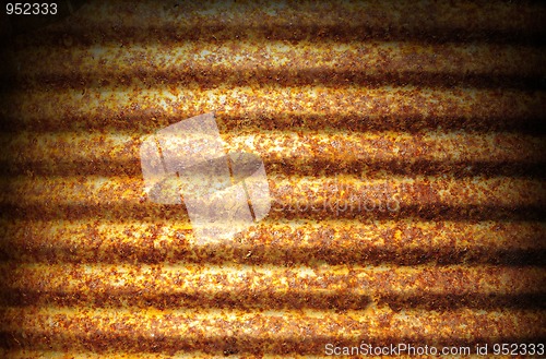 Image of Rusty corrugated metal surface lit dramatically