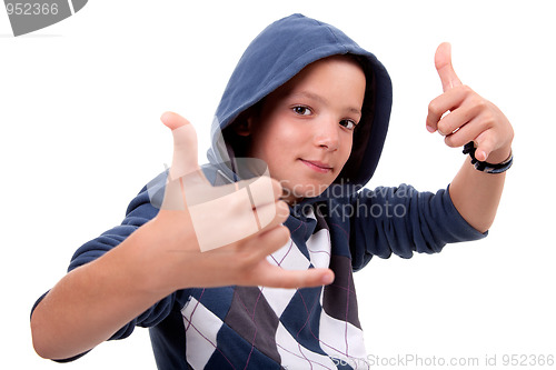 Image of boy with his hands rise up as a sign of everything cool