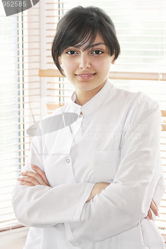 Image of Smiling brunette in smock