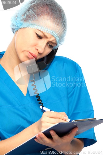 Image of pensive nurse with phone