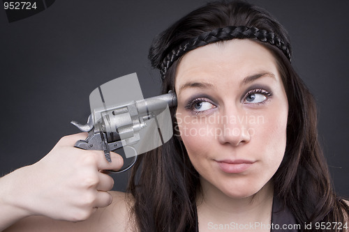 Image of Gun At Womans Head