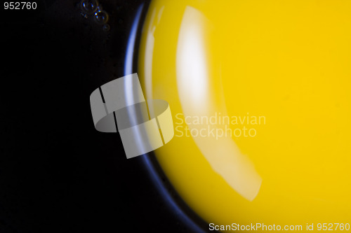 Image of Raw egg in frying pan