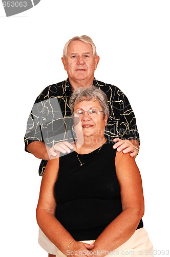 Image of Senior couple sitting for portrait.