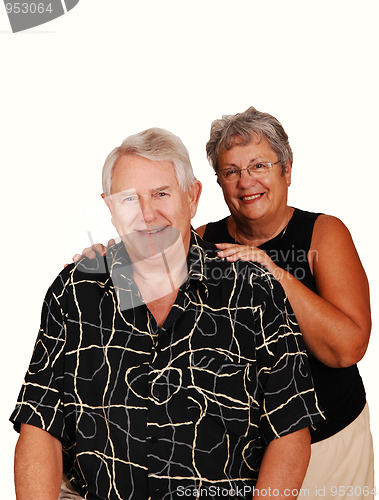 Image of Senior couple sitting for portrait.