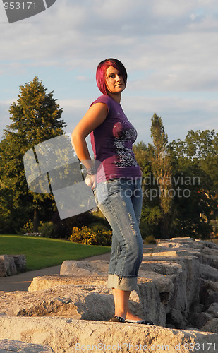 Image of Girl standing on lakeshore.