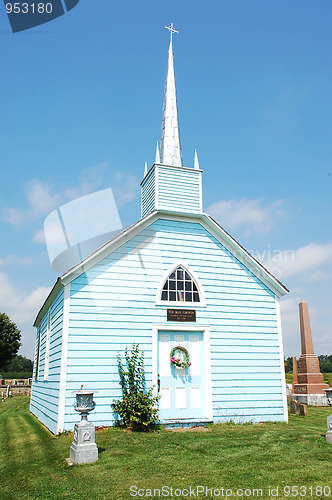 Image of An blue wooden church.
