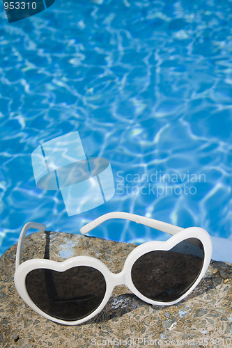 Image of Sunglasses by the Pool