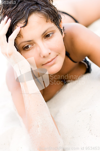 Image of woman lying on a sand