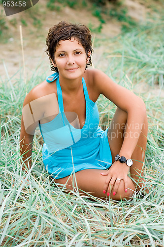 Image of attractive brunet woman in blue