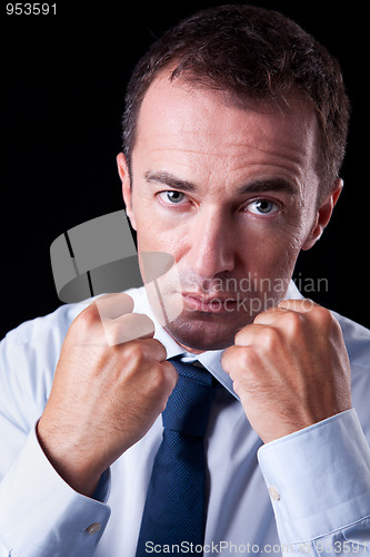 Image of Businessman punching fist: sign of competition