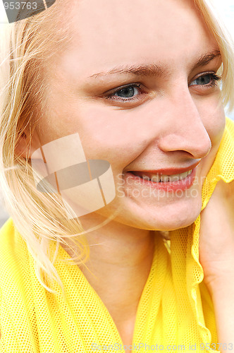 Image of Pretty girl in yellow blouse.