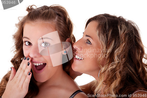 Image of mother telling a secret to his daughter admired