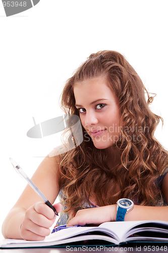 Image of beautiful girl studying and smiling