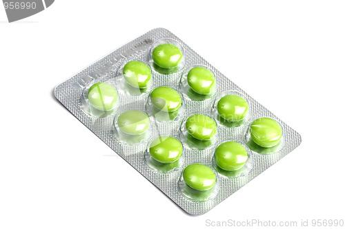 Image of Package of green pills isolated on white 