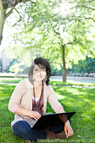 Image of Mixed race college student with laptop