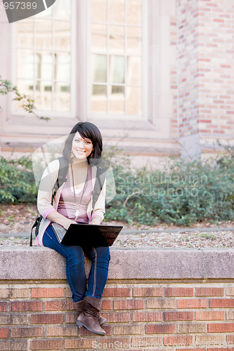 Image of Mixed race college student with laptop