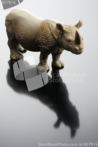 Image of A plastic figurine of a rhinoceros