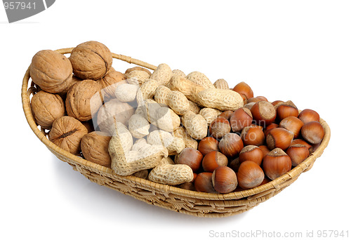 Image of Set of nuts in a wicker basket, isolation
