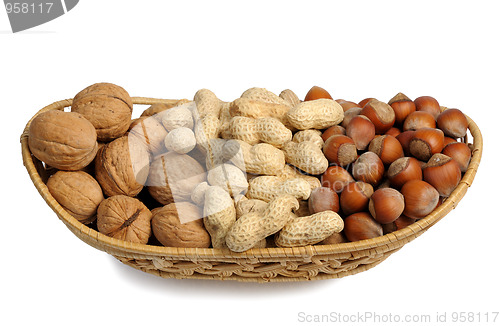Image of Set of nuts in a wicker basket, isolated