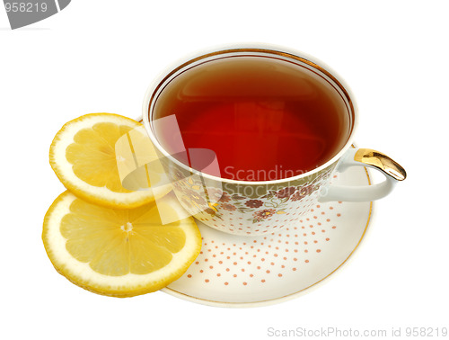 Image of A cup of tea and slices of lemon