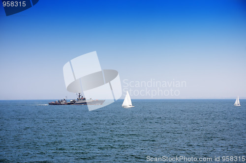 Image of Battleship and sailboats