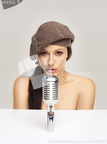 Image of Sexy woman singing in retro mic