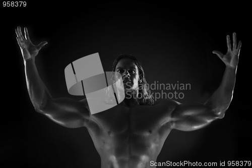 Image of  Dramatic image of a beautifully sculpted bodybuilder