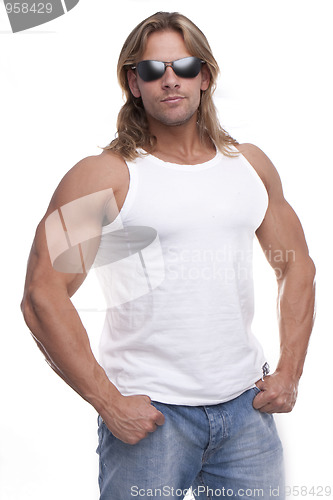 Image of Athletic sexy male body builder with the blonde long hair. gladi