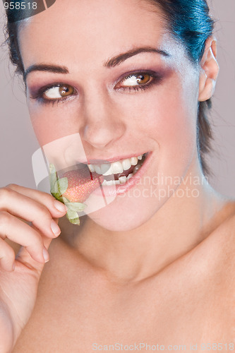 Image of Image of beautiful girl holding strawberry