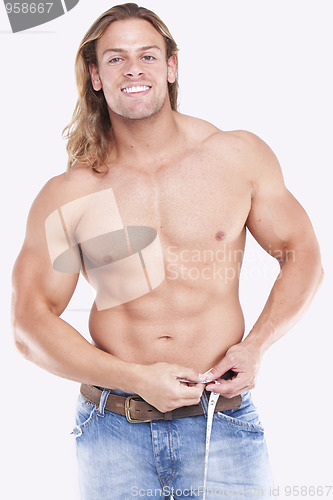 Image of Athletic sexy male body builder with the blonde long hair. gladi