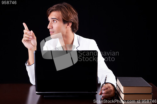 Image of young businessman on the computer