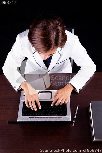 Image of young businessman on the computer 