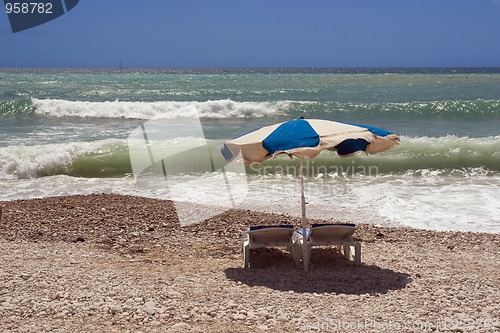 Image of Beach chairs and umbrella